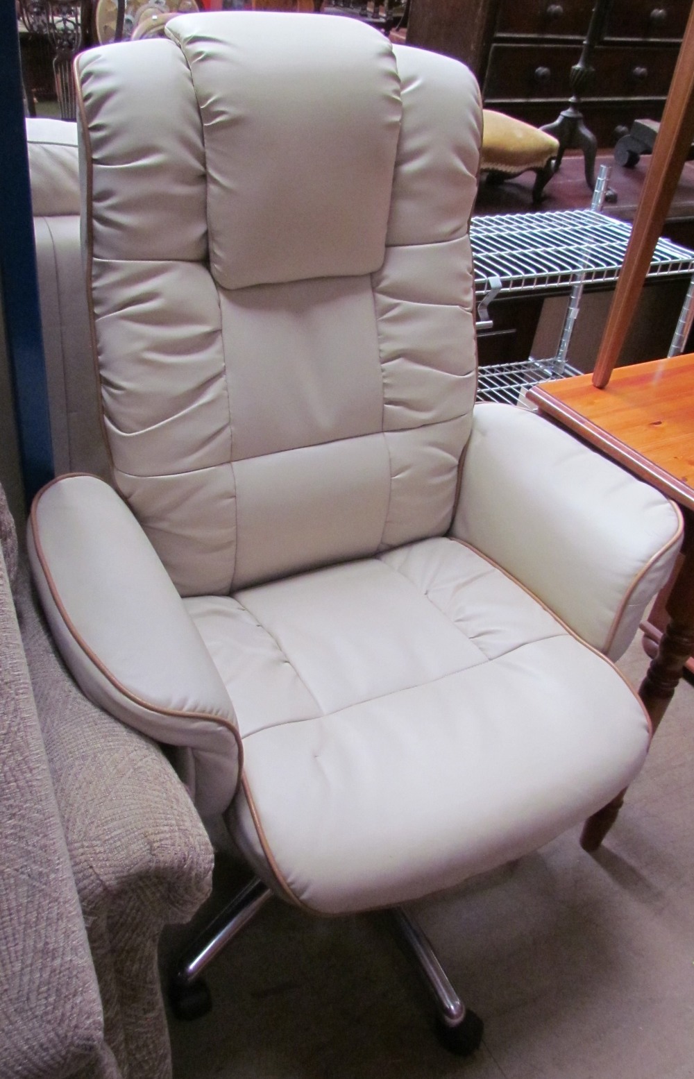 A cream leather office chair