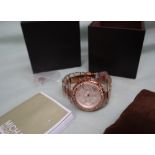A large collection of lady's and gentleman's wristwatches including Michael Kors, Van Heusen,