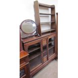 An Edwardian rosewood display cabinet with a rectangular top above glazed doors on cabriole legs
