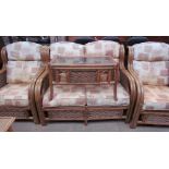 A wicker conservatory suite comprising a two seater settee,