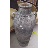 A large terracotta twin handled floor vase