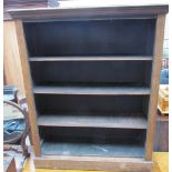 A 20th century oak bookcase with a moulded cornice above three shelves on a plinth