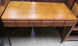 A mid 20th century oak desk with a rectangular top above six drawers on black metal square section