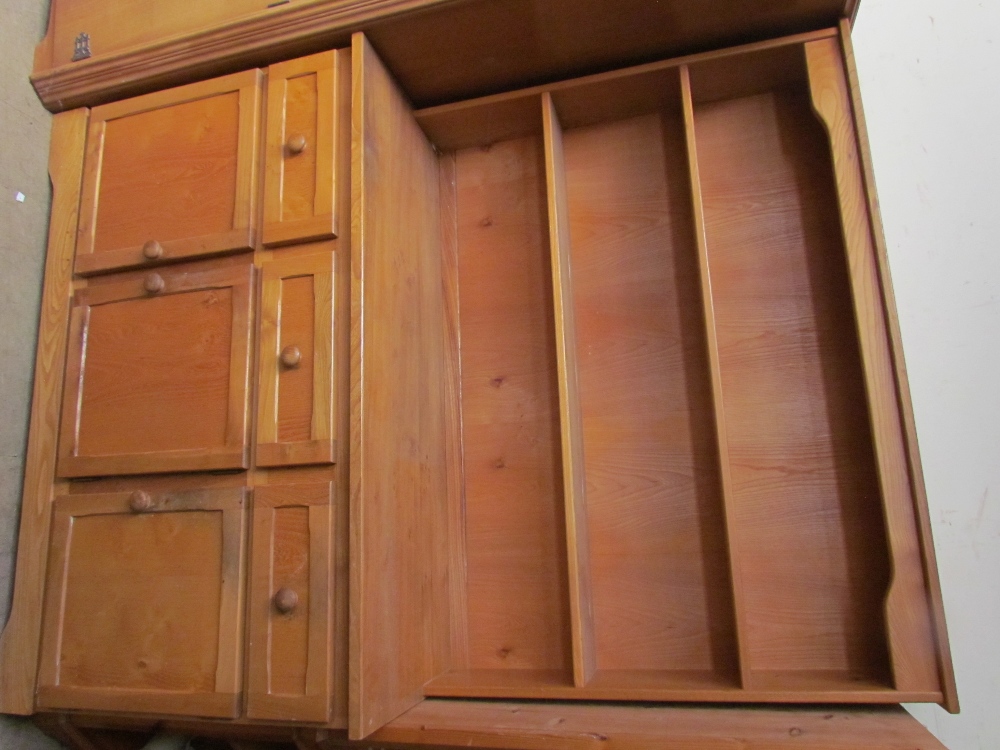 A 20th century ash dresser with a planked back above three short drawers and three cupboards on a - Image 3 of 3