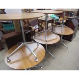 A set of six cafe tables with circular melamine tops on chrome columns and a four splayed legs
