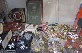 St Johns ambulance medallions together with cap badges,