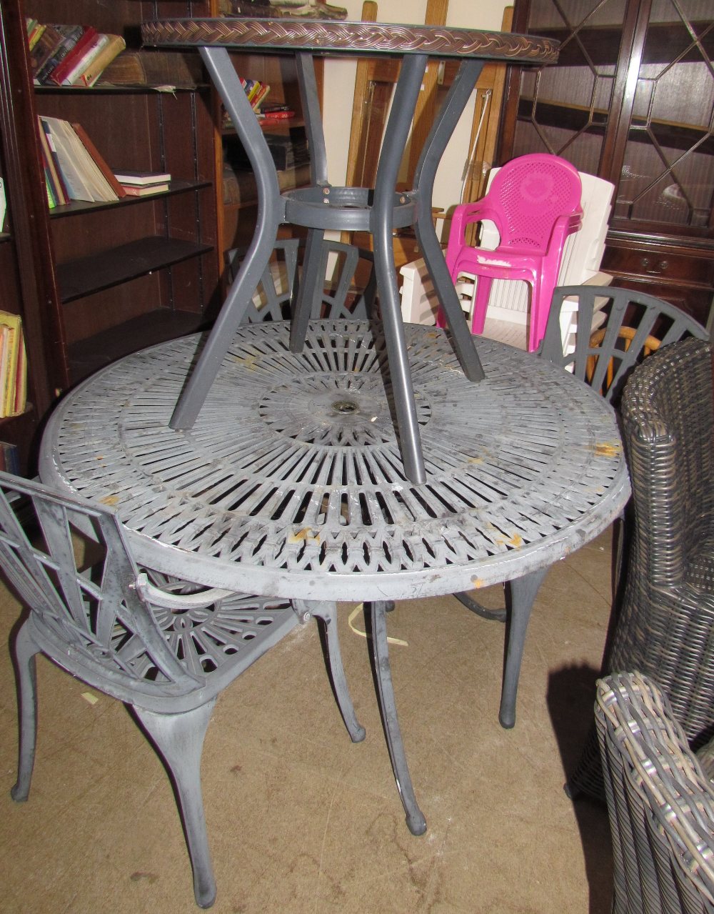 Garden furniture - a metal table and three chairs together with a glass topped table,