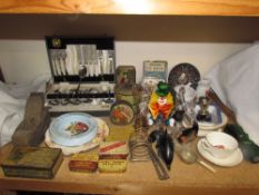 A Poole pottery dolphin together with a Murano glass clown, tins, plane, part flatware service,
