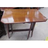 An Edwardian mahogany Sutherland table with drop flaps and cut corners on square legs