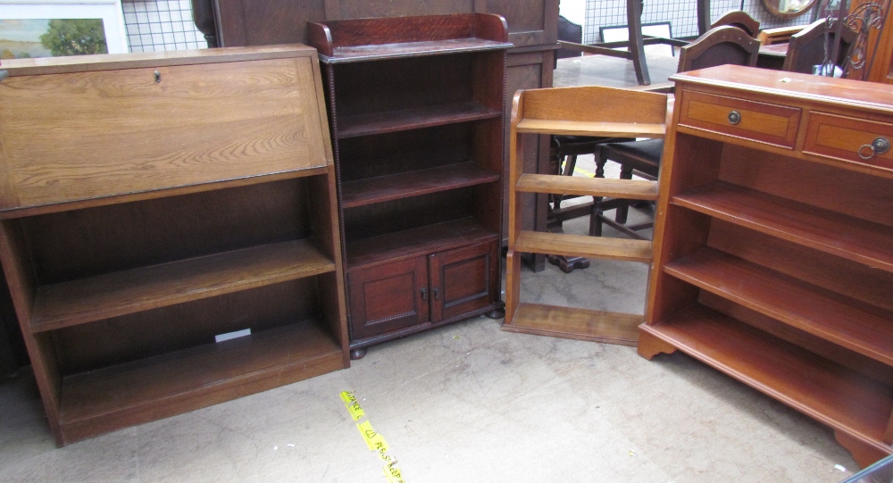 An ash bureau with bookcase base together with two other oak bookcases,