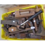 A large collection of tools including planes, saws,