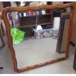 A shaped wall mirror together with a pair of Lowry prints and another print