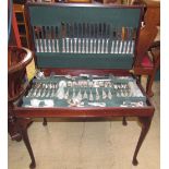An electroplated Kings pattern flatware service contained in a reproduction mahogany side table on