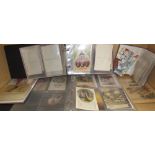 A collection of postcards in albums