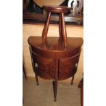 A reproduction mahogany side / sewing table,