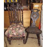 A carved oak spinning chair decorated with flowerheads and leaves,