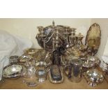 An electroplated four piece tea set together with a pair of candleabra, trays,
