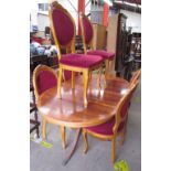 A modern yew wood dining suite comprising an extending dining table and six upholstered chairs