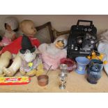 A Bell & Howell projector, Model 256 EX together with dolls, toys, brass wares, pottery jugs,