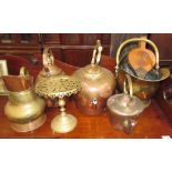 A copper kettle together with a brass coal scuttle, other copper kettles, brass trivet,