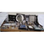 A Mappin and Webb electroplated salver, together with a collection of photograph frames,