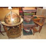 A globe drinks cabinet with a hinged top and sectional interior together with a pair of side tables