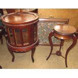 A mahogany tray top display cabinet with bevelled glass panels on square tapering legs together