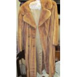 A full length fur coat with marcasite set lattice buttons