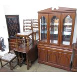 A 20th century oak gateleg dining table together with a set of five oak ladder back dining chairs,