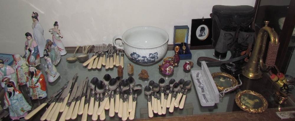 Chinese porcelain figures together with a part flatware service, binoculars, wristwatches,