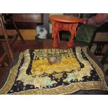 A Rangoon wall hanging with bead and padded decoration together with a Burmese lacquer table and a