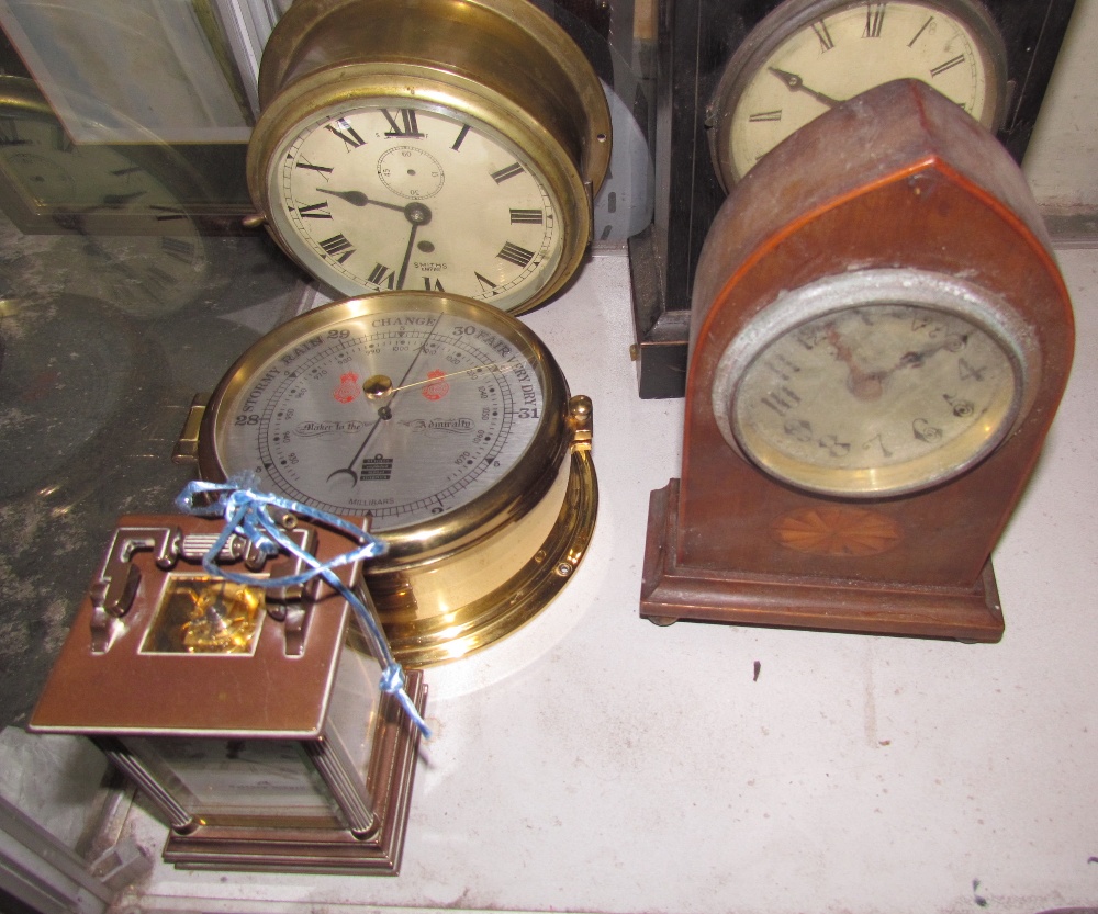 A Matthew Norman carriage clock together with a bulk head time piece,