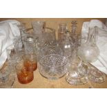 A large glass fruit bowl together with glass candlesticks,