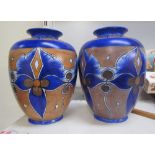 A pair of Clews & Co chameleon ware vases in blues and browns