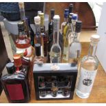 Assorted bottles of alcohol including Baileys, Grappa, Famous Grouse,