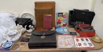 A leather writing slope and letters, together with a typewriter, leather case, stamps, teapot,