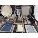 A Mappin and Webb electroplated salver, together with a collection of photograph frames,