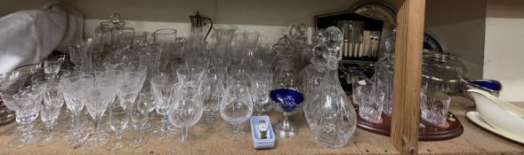 A cased flatware service together with a large quantity of cut glass decanters, drinking glasses,