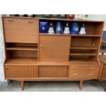 A Mid 20th century teak wall unit, with a drop down door,