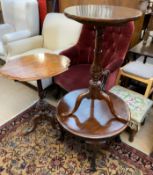 A Victorian walnut tripod table with a moulded shaped top on a tapering column and leaf carved