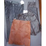 Three pairs of black leather trousers and four brown leather skirts by Nicole Fahri,