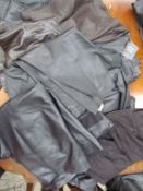 A collection of leather skirts and trousers by designers such as Daniel Hechter,