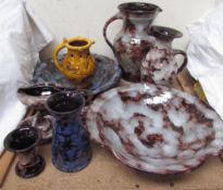 A Ewenny pottery puzzle jug, made by Caitlin Jenkins, together with Ewenny pottery dishes, jugs,