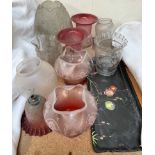 A collection of glass oil lamp and gas lamp shades and a pottery tray