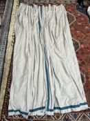 A Pair of natural linen lined curtains with teal ribbon edge detail approximately 208 x 150cm