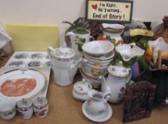 A studio pottery jug together with other pottery jugs, plates, egg coddlers,