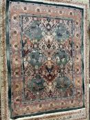 A modern green ground rug decorated with geometric patterns, horses and flowers,