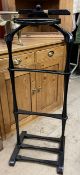 An ebonised Gentleman's stand with jacket rest,