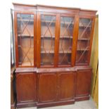 A reproduction mahogany breakfront bookcase, the with a moulded cornice above three astragal doors,