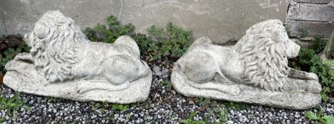 A pair of reconstituted stone models of recumbent lions